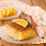 a slice of Portokalopita Greek Orange Phyllo Cake on a plate with orange slices on top