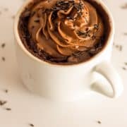 vegan mug brownie with chocolate buttercream frosting and chocolate sprinkles