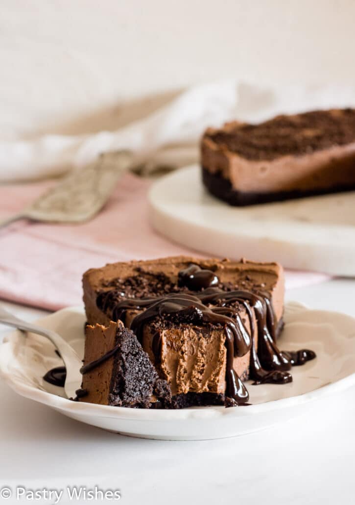 a slice of eggless chocolate cheesecake on a plate