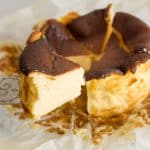 A slice of mini burnt cheesecake on a cake server.