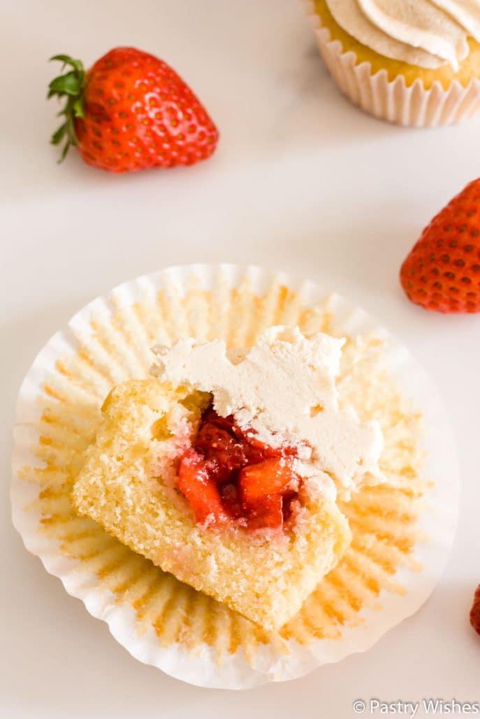 a strawberry filled cupcake cut in half