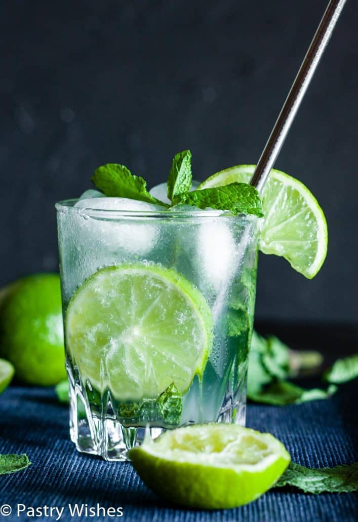 virgin mojito with sprite, mint leaves, ice and lime in a glass