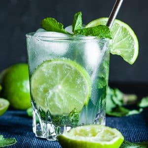 Virgin mojito with sprite, mint leaves, ice and lime in a glass.