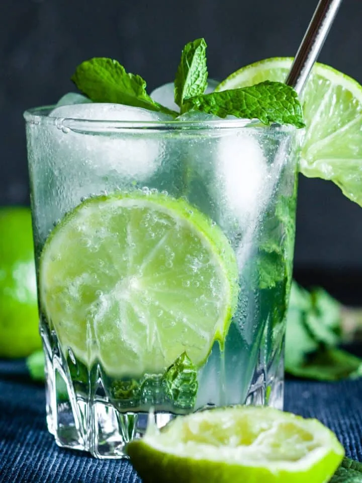 Virgin mojito with sprite, mint leaves, ice and lime in a glass.