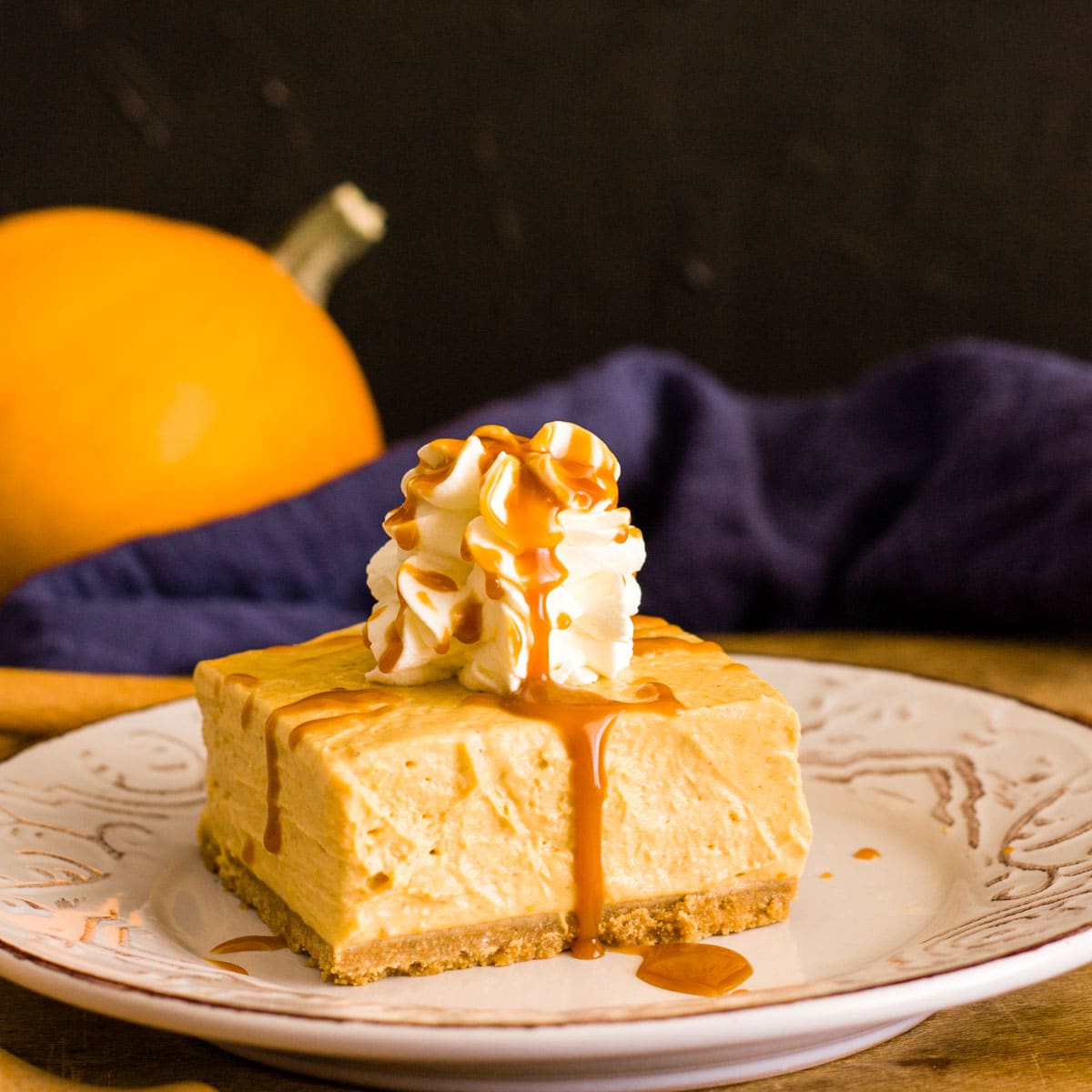 a slice of pumpkin cheesecake on a plate