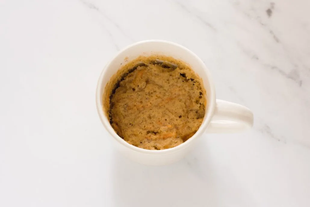 A cooked carrot mug cake.