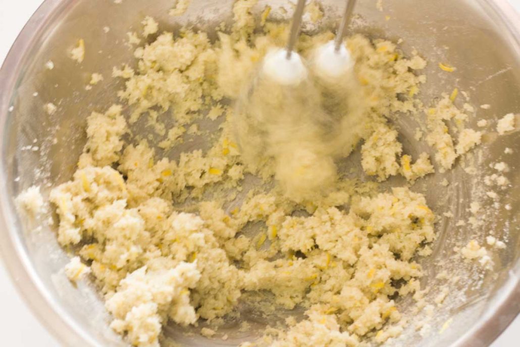 Beating butter and lavender sugar together.