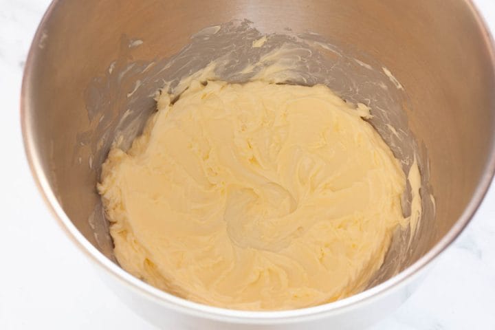 Creamed butter in the bowl of a stand mixer.