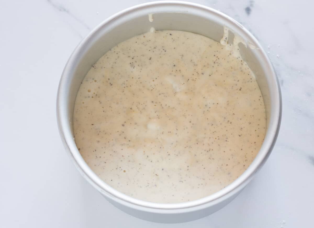 Earl Grey lavender cake batter in a cake pan, ready to be baked.