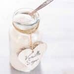 Homemade vanilla sugar in a glass jar.