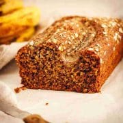 Sliced dairy-free banana bread with ripe bananas