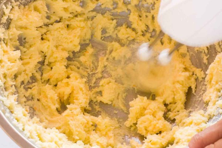 Creaming butter and sugar to make koulourakia dough.