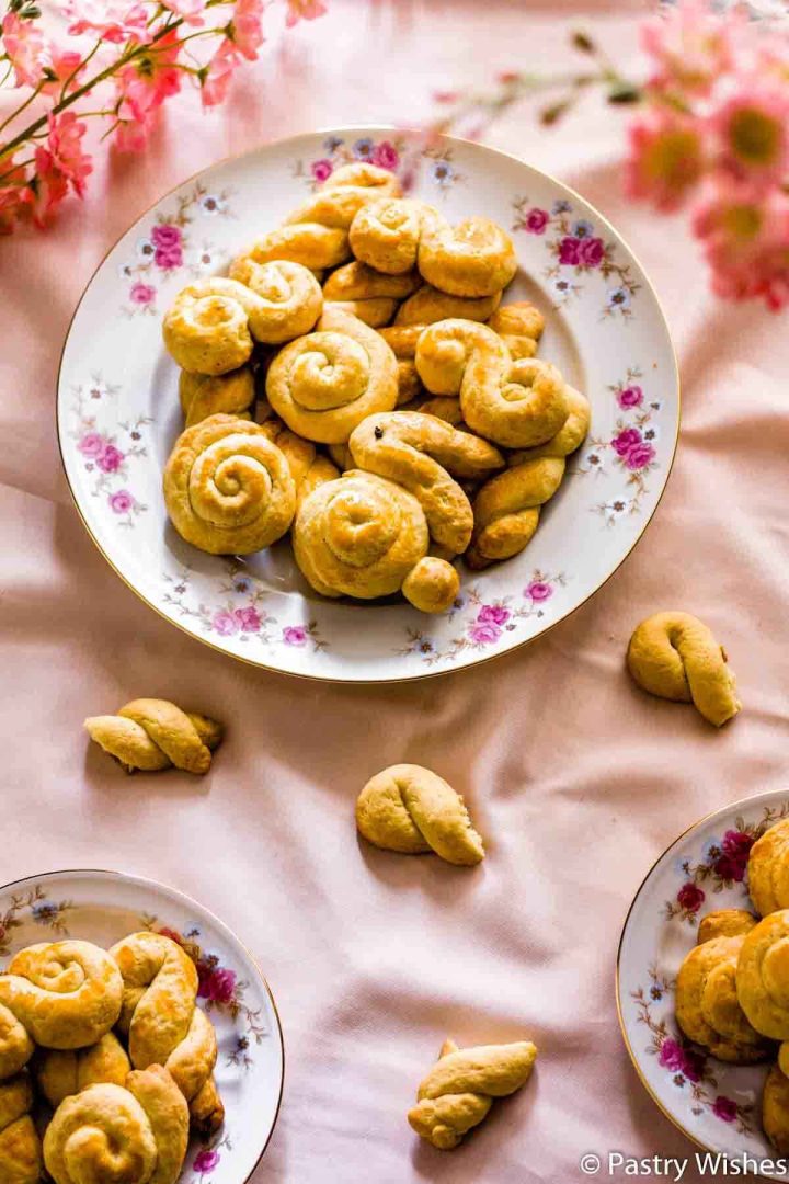 Traditional Greek Easter cookies (koulourakia) on a plate.