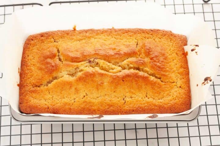 Lemon raspberry loaf cake baking in a loaf pan.