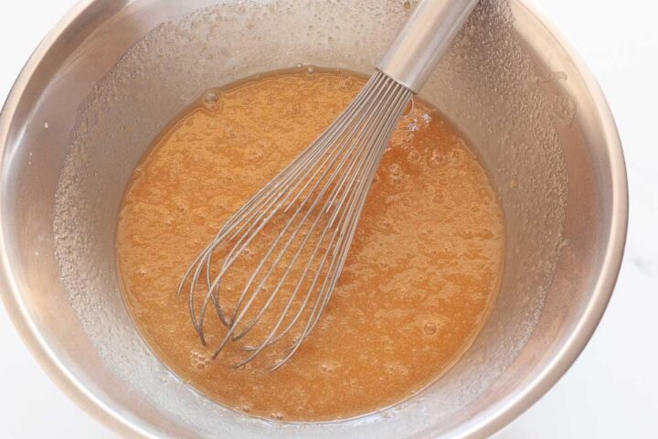 Wet ingredients for carrot cake whisked together until smooth.