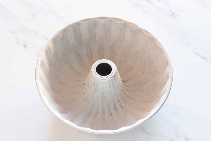 Greased and floured Bundt pan ready for carrot cake batter.