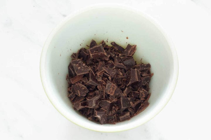 Chopped chocolate in a bowl for making ganache, step 1.