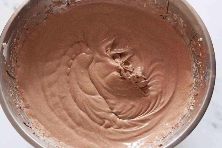 Chocolate cheesecake batter fully mixed and silky smooth.