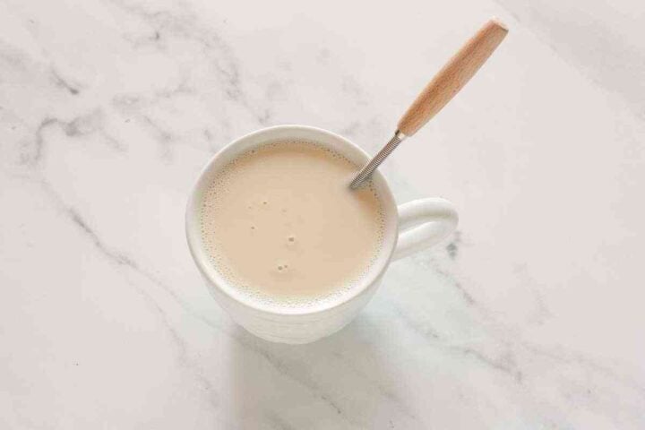Step 1: Almond milk and vinegar stirred together to make dairy-free buttermilk for blueberry muffins.