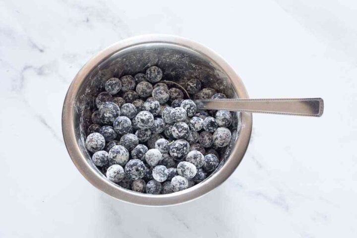 Step 3: Blueberries lightly coated in flour to help keep them from sinking in the muffin batter.