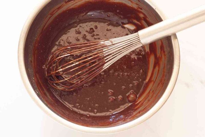 Melted chocolate mixture whisked into the egg and sugar mixture.